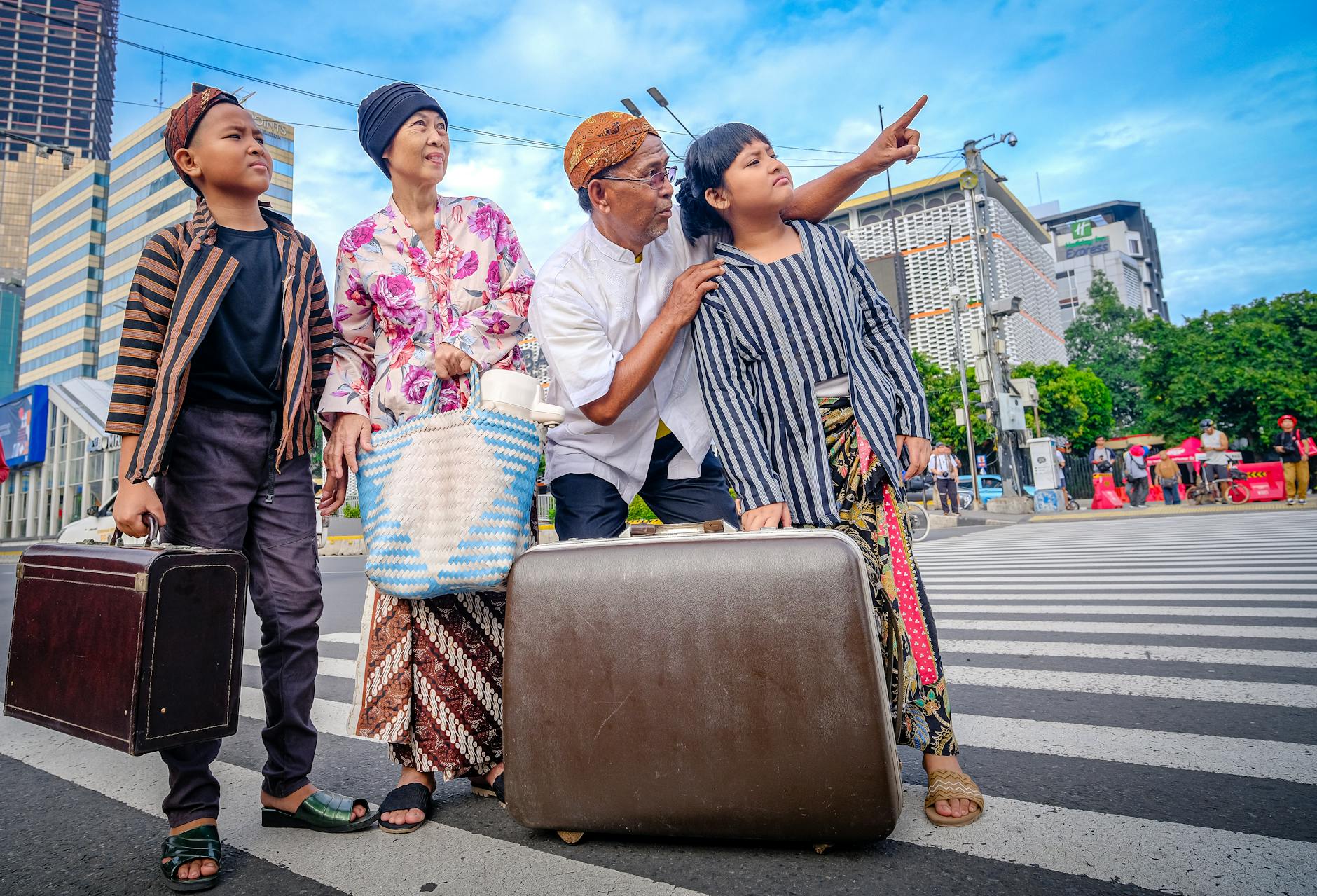 Ilustrasi: A family in traditional Javanese clothing crosses a street in Jakarta, suggesting a cultural journey.