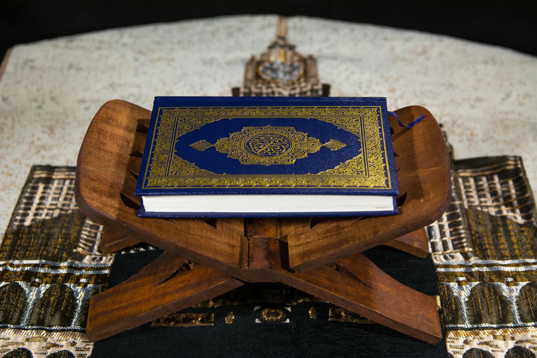 Ilustrasi: Close-up of the Quran on a wooden stand, symbolizing Islamic spirituality.